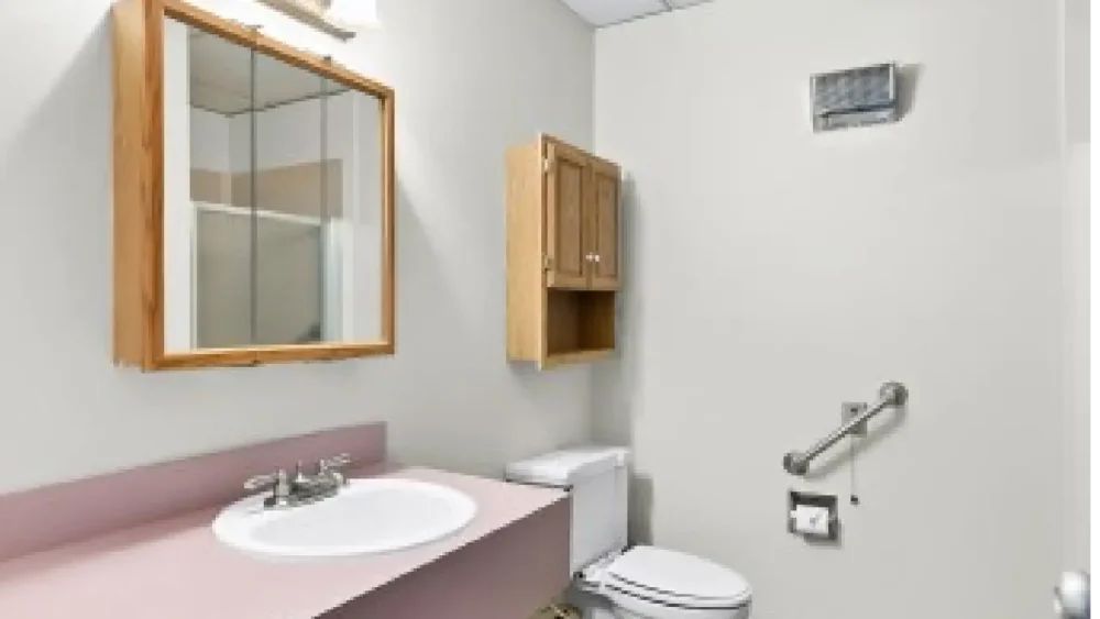 a toilet with mirror